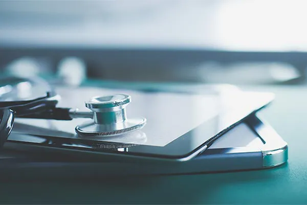 Advanced-Diagnostic-Testing-Clinic Close up of a stethoscope lying on a tablet, representing advanced functional medicine testing offered by Frank Lanzisera, D.C. in Tampa Bay Metro.