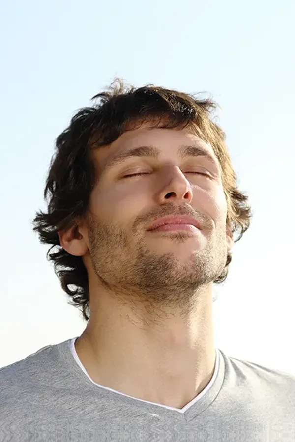 Depression-Treatment A man with closed eyes and a smile turns his head to the sky calmly. Get treatment for depression from Frank Lanzisera, D.C. in Tampa Bay Metro.