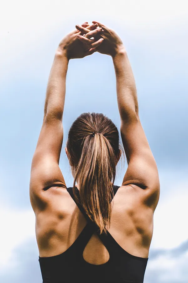 Get-Up-and-Go-IV-Therapy-Treatment A toned woman stretches her arms before a workout. Get Get Up & Go IV therapy from Frank Lanzisera, D.C. in Tampa Bay Metro.