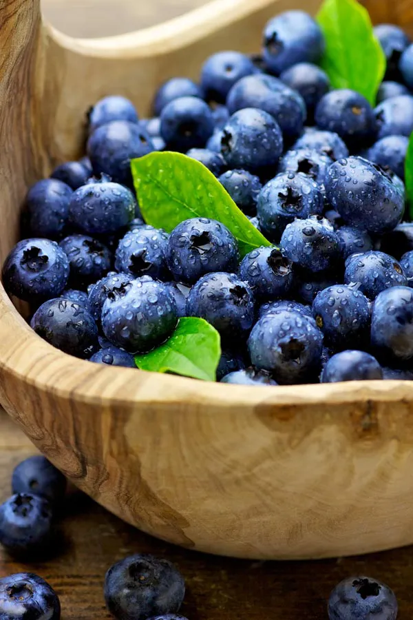 IV-Therapy-Treatment A bowl of refreshing, nourishing blueberries in a wooden bowl, representing IV therapy from Frank Lanzisera, D.C. in Tampa Bay Metro.