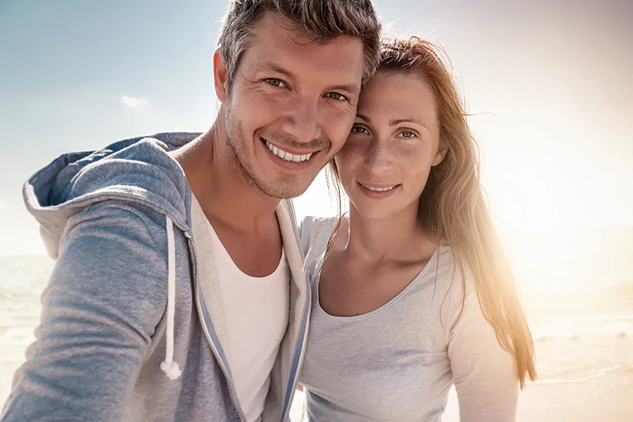IV-Therapy-for-Skin-Health-Clinic A middle-aged couple with youthful skin at the beach. Get IV Therapy for skin health from Frank Lanzisera, D.C. in Tampa Bay Metro.