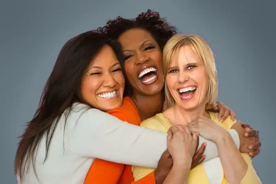 Insulin-Resistance-Clinic An asian, black, and white woman of middle age hug and laugh. Get insulin resistance treatment from Frank Lanzisera, D.C. in Tampa Bay Metro.
