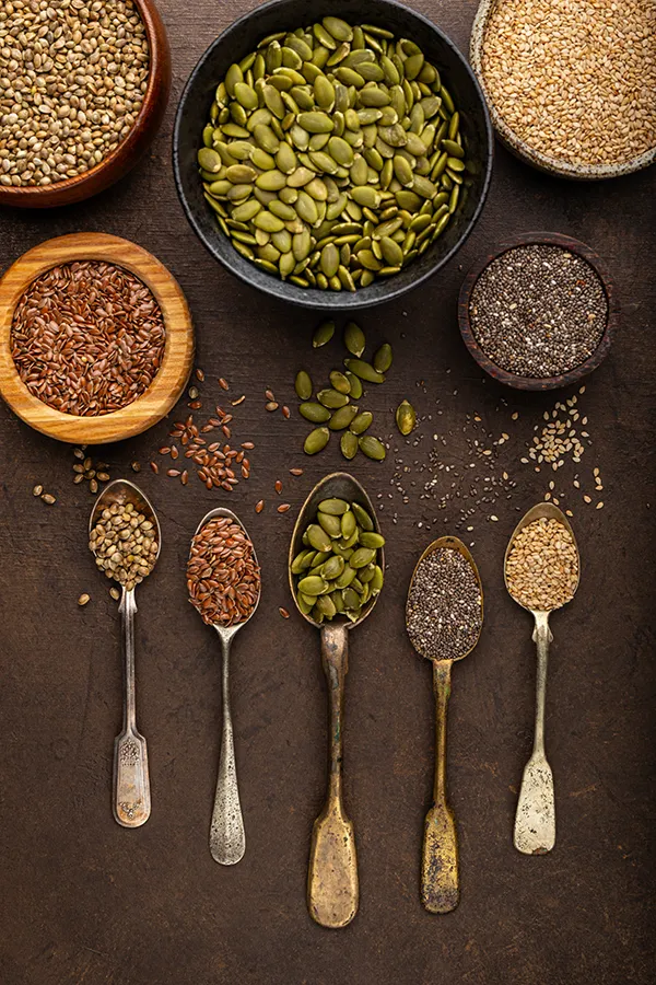 Mineral-IV-Drip-Treatment A variety of herbs and nuts in spoons and bowls. Get Brainstorm IV therapy from Frank Lanzisera, D.C. in Tampa Bay Metro.