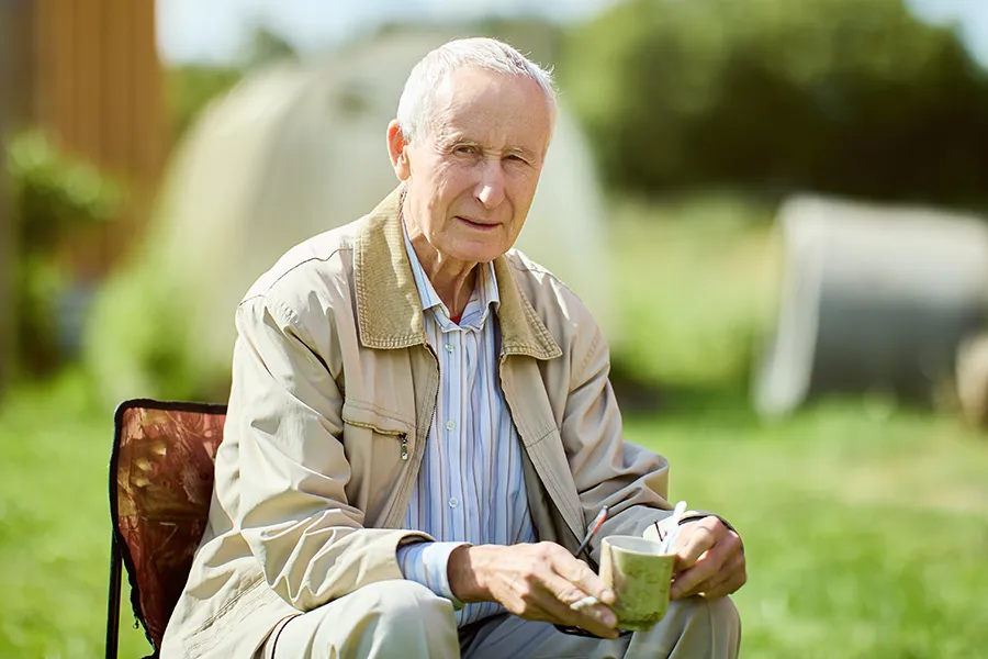 Muscle-Atrophy-Clinic A very thin older man sits outside. Get treatment for muscle atrophy from Frank Lanzisera, D.C. in Tampa Bay Metro.