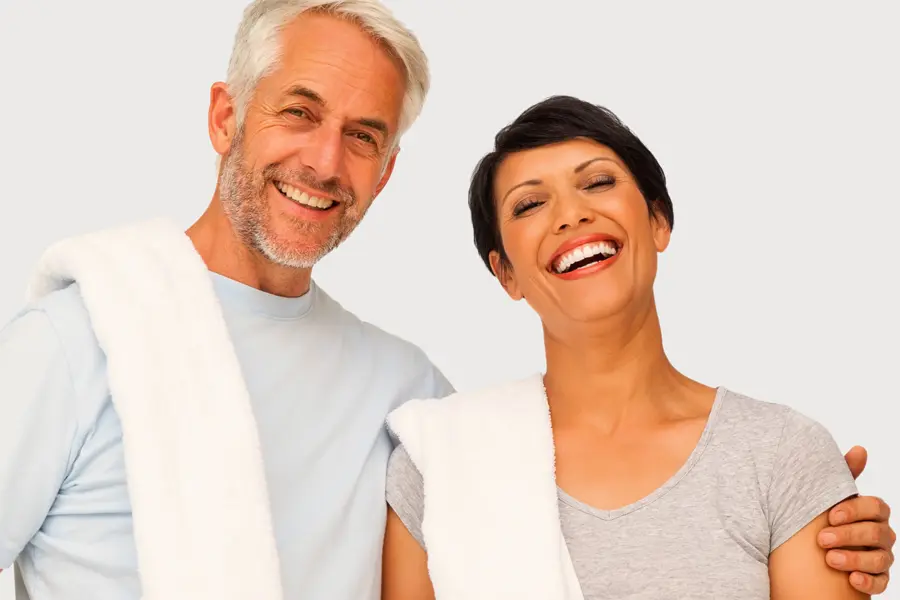 PEMF-Therapy-Clinic A mature man and woman with towels draped over their shoulders smiling after a work out. Get PEMF Pulsed Electromagnetic Field therapy from Frank Lanzisera, D.C. in Tampa Bay Metro.