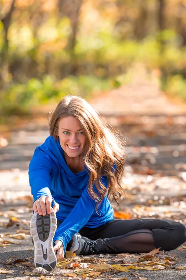 Performance-Recovery-IV-Therapy-Treatment A woman stretches before a trail run. Get IV Therapy for performance recovery relief from Frank Lanzisera, D.C. in Tampa Bay Metro.
