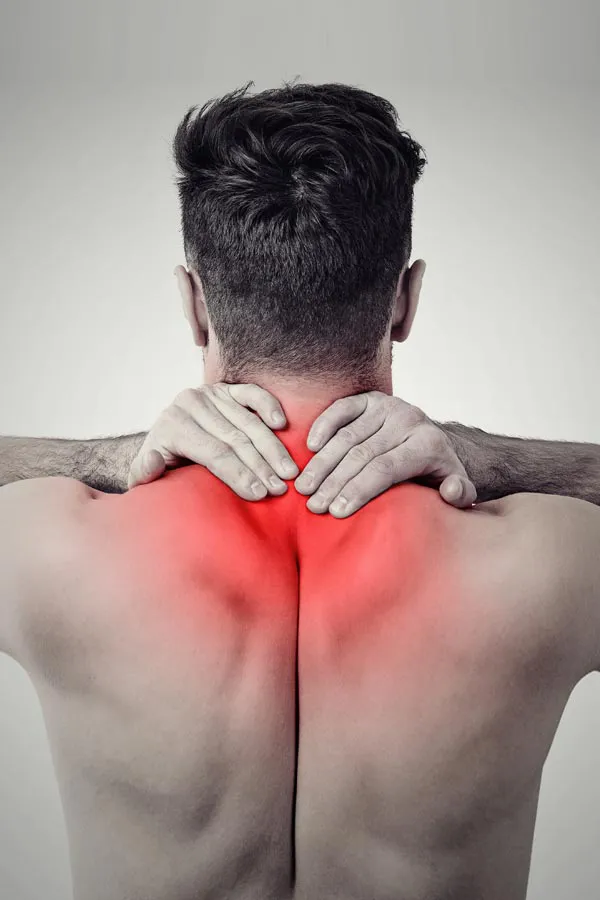 Regenerative-Medicine-for-Back-Pain-Treatment A man holds his upper back in pain. Get Regenerative Medicine for Back Pain from Frank Lanzisera, D.C. in Tampa Bay Metro.