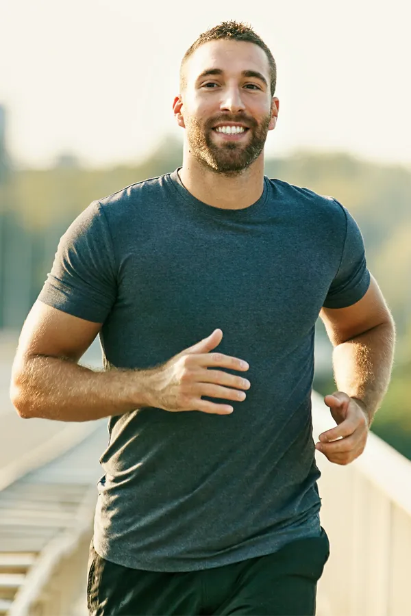 Regenerative-Medicine-for-Joint-Pain-Treatment A man happily running for exercise. Get regenerative medicine for joint pain from Frank Lanzisera, D.C. in Tampa Bay Metro.