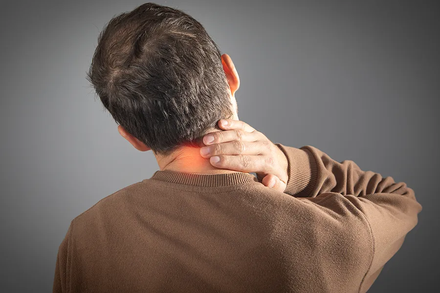 Regenerative-Medicine-for-Neck-Pain-Clinic A man rubs his neck in pain. Schedule Regenerative Medicine for Neck Pain from Frank Lanzisera, D.C. in Tampa Bay Metro.