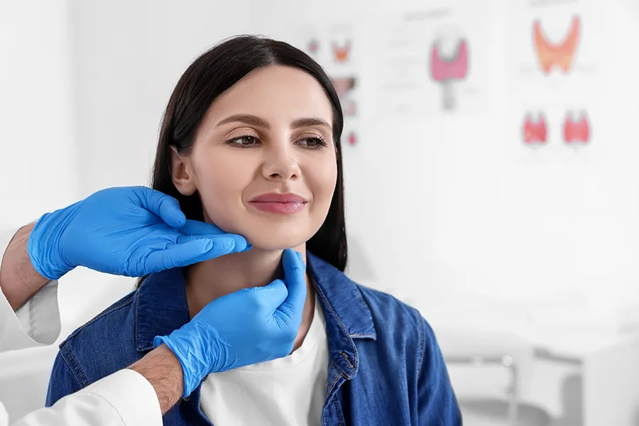 Thyroid-Optimization-Clinic A woman gets a thryoid examination. Get thyroid optimization treatment from Frank Lanzisera, D.C. in Tampa Bay Metro.