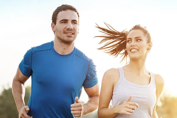 Weight-Loss-Resistance-Doctor A couple happily jogging in the sunlight after receiving effective weight loss resistance care from Frank Lanzisera, D.C. in Tampa Bay Metro.